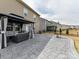 Backyard patio featuring a stone paver design, a gazebo, and a view of the fenced yard at 15954 Harbor Hill Dr, Charlotte, NC 28273