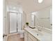 Well-lit bathroom with a shower, vanity, and a large mirror for an open feel at 15954 Harbor Hill Dr, Charlotte, NC 28273