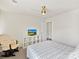 Comfortable bedroom with white shelving unit, and door with polka dots detail at 15954 Harbor Hill Dr, Charlotte, NC 28273