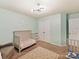 Neutrally painted Bedroom featuring two baby cribs and star-themed area rug at 15954 Harbor Hill Dr, Charlotte, NC 28273