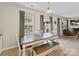 Dining area featuring a wooden table, bench seating, and windows providing natural light at 15954 Harbor Hill Dr, Charlotte, NC 28273