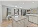 Open concept kitchen with large island, stainless appliances, and seamless flow to the dining and living areas at 15954 Harbor Hill Dr, Charlotte, NC 28273