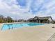 Large community pool with clear blue water, surrounding lounge area, and a charming pool house perfect for recreation at 15954 Harbor Hill Dr, Charlotte, NC 28273