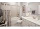 Bright bathroom with a shower-tub combo, a framed art piece, and a sink with a white vanity and countertop at 1715 Rhynes Trl, Rock Hill, SC 29732