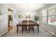 Inviting dining room with hardwood floors, a classic dining set, and large window for natural light at 1715 Rhynes Trl, Rock Hill, SC 29732