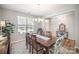 Bright dining room featuring a chandelier and a view of the front yard at 1715 Rhynes Trl, Rock Hill, SC 29732