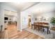 Open-concept dining room with a dining table, hardwood floors, and natural light, connecting to the living room at 1715 Rhynes Trl, Rock Hill, SC 29732