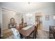 Elegant dining room with hardwood floors, decorative rug, and a wooden dining table with chairs at 1715 Rhynes Trl, Rock Hill, SC 29732