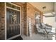 Inviting front porch featuring comfortable seating, a 'Welcome' sign, and a stylish wreath on the dark front door at 1715 Rhynes Trl, Rock Hill, SC 29732