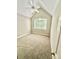 Vaulted bedroom with neutral carpet and large picture window at 18845 Cloverstone Cir, Cornelius, NC 28031