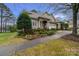 Charming home featuring well-manicured landscaping and a welcoming front porch with stately columns at 18845 Cloverstone Cir, Cornelius, NC 28031