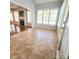 Sun-filled room with tile floors and many windows, perfect for relaxing and enjoying the view at 18845 Cloverstone Cir, Cornelius, NC 28031