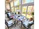 Inviting sunroom with multiple windows and comfortable seating at 18845 Cloverstone Cir, Cornelius, NC 28031
