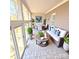 Inviting sunroom with multiple windows and comfortable seating at 18845 Cloverstone Cir, Cornelius, NC 28031