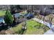 An aerial shot of the home surrounded by mature trees and a green yard at 2530 31St Street Ne Dr, Hickory, NC 28601