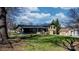 Wide view of the backyard with a well-manicured lawn, showing the layout of the house and storage shed at 2530 31St Street Ne Dr, Hickory, NC 28601