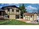 View of the backyard of a two-story home with a wooden shed on a concrete pad at 2530 31St Street Ne Dr, Hickory, NC 28601