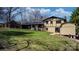 Backyard perspective featuring a well-maintained lawn, partial view of the house, and a storage shed at 2530 31St Street Ne Dr, Hickory, NC 28601