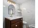 Modern bathroom with a vanity, a toilet, and a marble tiled wall at 2530 31St Street Ne Dr, Hickory, NC 28601