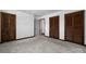 Bedroom with three closet doors, plush carpeting, and neutral walls at 2530 31St Street Ne Dr, Hickory, NC 28601