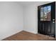 Close up of an entryway with a black front door with decorative glass inserts and ceramic tile floors at 2530 31St Street Ne Dr, Hickory, NC 28601