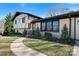 Charming two-story home with brick and Tudor-style architecture, a curved walkway, and landscaped front yard at 2530 31St Street Ne Dr, Hickory, NC 28601