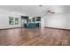 Open-concept living room and kitchen with hardwood floors, ample natural light, and modern appliances at 2530 31St Street Ne Dr, Hickory, NC 28601