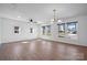 Sunlit living room showcases hardwood floors and multiple windows for ample natural light, and a ceiling fan at 2530 31St Street Ne Dr, Hickory, NC 28601