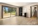 Bright living room featuring wood floors, wet bar, and sliding glass door to the backyard at 2530 31St Street Ne Dr, Hickory, NC 28601