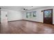 Bright living room with hardwood floors, ceiling fan and a view of the front yard at 2530 31St Street Ne Dr, Hickory, NC 28601