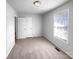 A carpeted bedroom features neutral walls and a window with blinds at 2725 Fair Oaks Dr, Gastonia, NC 28054