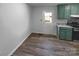 Eat-in kitchen features painted cabinets, stone countertops, and vinyl flooring at 2725 Fair Oaks Dr, Gastonia, NC 28054