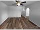 An open-concept living room features new vinyl flooring and a ceiling fan at 2725 Fair Oaks Dr, Gastonia, NC 28054