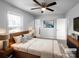 Tranquil bedroom featuring a ceiling fan, modern decor, and an ensuite bathroom at 2725 Fair Oaks Dr, Gastonia, NC 28054