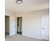 Bright bedroom featuring neutral walls, a modern light fixture, and an ensuite bathroom, enhancing comfort and convenience at 2868 Oasis Ln, Charlotte, NC 28214