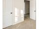 This bedroom features neutral carpet, open doorways, and closet doors, creating an open and inviting space at 2868 Oasis Ln, Charlotte, NC 28214