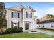 Two-story home with neutral siding, dark shutters, and well-manicured lawn, showcasing curb appeal and charm at 2868 Oasis Ln, Charlotte, NC 28214