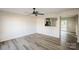 Bright and spacious living room with new floors, modern ceiling fan, and an open floor plan at 2868 Oasis Ln, Charlotte, NC 28214