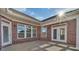 Wide covered patio with brick columns and an extended living space at 3069 Founding Fathers Dr # 38, Gastonia, NC 28056