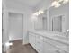 Bathroom featuring double vanity, dual mirrors, and recessed lighting at 3069 Founding Fathers Dr, Gastonia, NC 28056