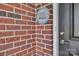 Close-up of a brick wall with the '1776 Community' plaque and the front door at 3069 Founding Fathers Dr # 38, Gastonia, NC 28056