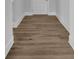 Hallway featuring attractive wood-look flooring, white trim, and neutral wall paint at 3069 Founding Fathers Dr, Gastonia, NC 28056