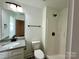 Bright bathroom featuring a vanity, shower, and toilet at 324 Ashford St, Chester, SC 29706