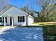 Charming single-story home with a new concrete driveway and a cozy front porch at 324 Ashford St, Chester, SC 29706