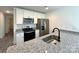 Bright kitchen featuring stainless steel appliances and granite countertops at 324 Ashford St, Chester, SC 29706