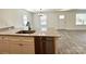 Kitchen island with stainless steel dishwasher and granite countertops at 324 Ashford St, Chester, SC 29706