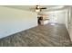 Open-concept living room with luxury vinyl flooring connected to the kitchen at 324 Ashford St, Chester, SC 29706