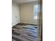 Bedroom with a double door closet, a window, and modern flooring creating a move-in-ready space at 3258 Killian Rd, Lincolnton, NC 28092