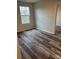 Bedroom featuring vinyl floors, a window and neutral paint at 3258 Killian Rd, Lincolnton, NC 28092