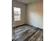 Bedroom featuring vinyl floors, a window and neutral paint at 3258 Killian Rd, Lincolnton, NC 28092